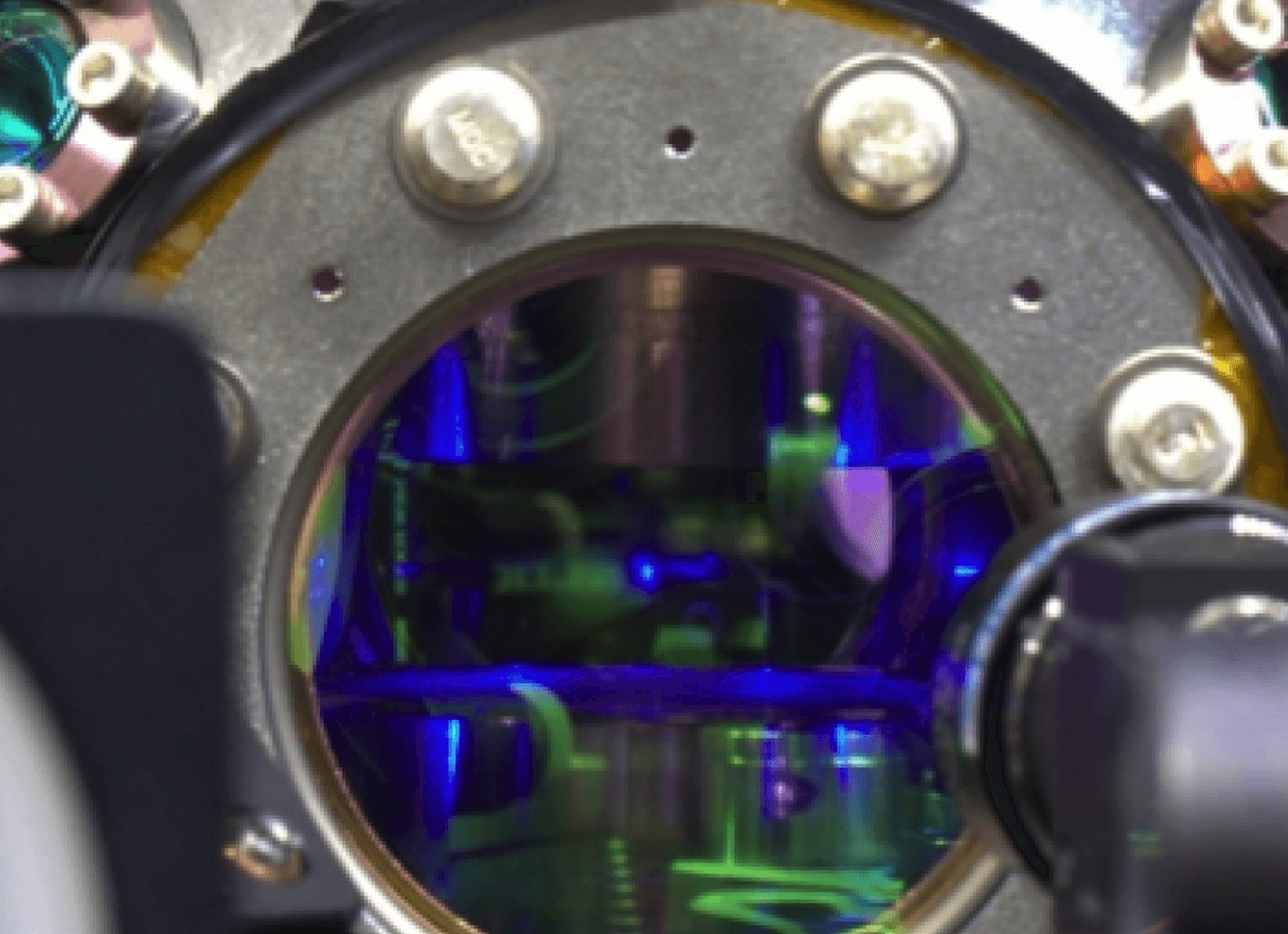 view of a strontium MOT through a vacuum chamber